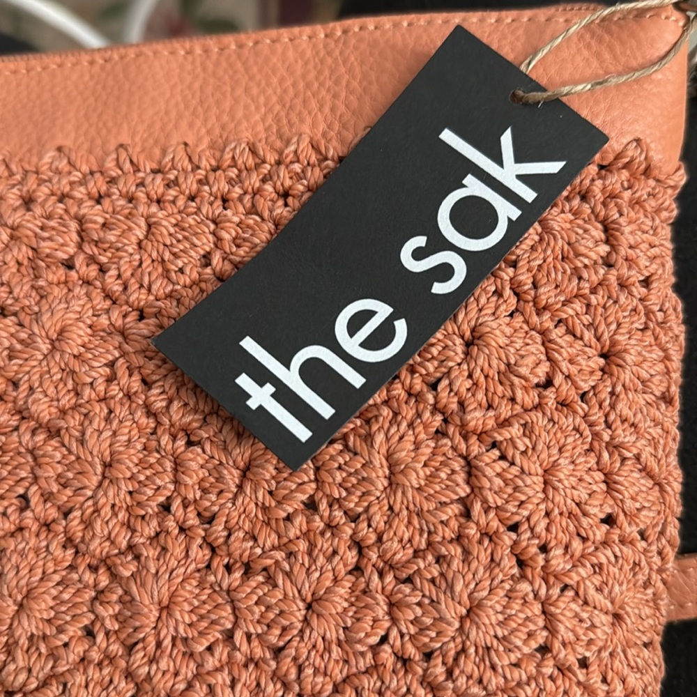 New The Sak women’s crocheted soft peach color crossbody purse. 11”W x 7 1/2” H. - Picture 12 of 14